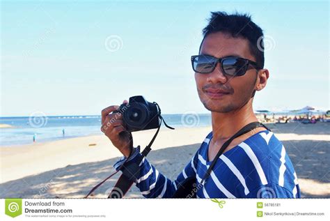 Indonesian Guy With Camera Stock Image Image Of Asia 56785181