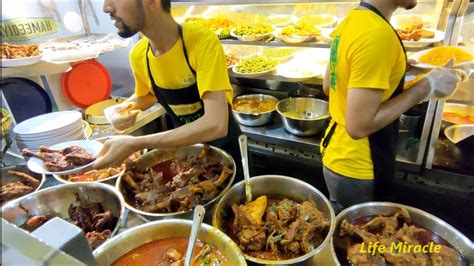 The rice for a nasi kandar dish is often placed in a wooden container about three feet high, giving it a distinctive aroma. 槟城美食美味印度咖哩鸡饭扁担饭 Malaysia Penang famous Nasi Kandar nasi ...