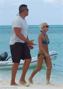 Donatella Versace Shows Off Her Super Svelte Figure In Blue And Gold Bikini During Beach