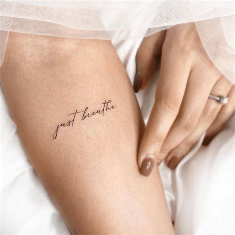 Just Breathe Lettering Tattoo On The Inner Forearm
