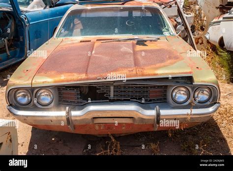 Rusty Old Plymouth Car In A Junk Yard In The Desert In Phoenix Arizona