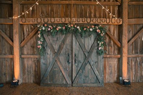 Think outside the box when choosing your cake topper—while you can pick a classic wood monogram or custom last name sign, you can also experiment with a design fits a barn wedding theme, like these woodland animals. A Rustic Chic Wedding at White Star Farm in London, Ohio