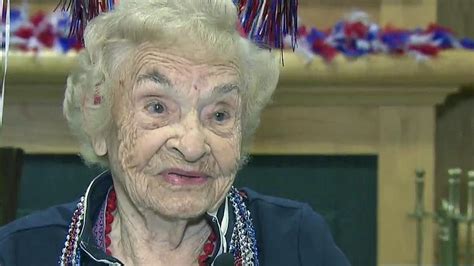 107 year old celebrates her birthday blows out candles and gives an important piece of advice