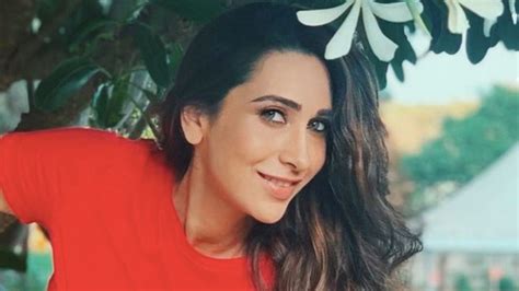 Karisma Kapoor In A Red Shirt Home