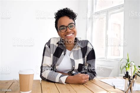 Happy Smiling African Girl Looking At Camera Making Video Call Stock