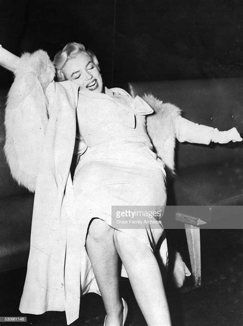 Marilyn Monroe Stretches After A Twa Flight From Hollywood To