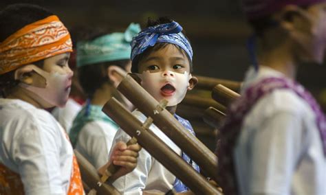 Children Wearing Face Mask Play Traditional Music Instrument Of