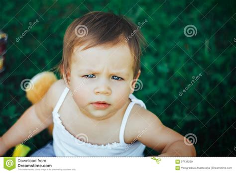 Frown Baby Girl Looking At The Camera Stock Photo Image Of Child