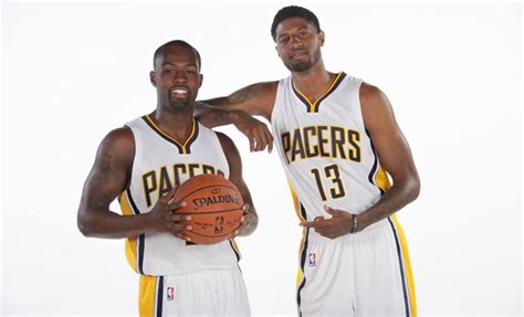 Two Basketball Players Are Posing For A Photo