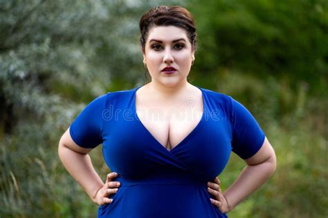 Plus Size Fashion Model In Blue Dress With A Deep Neckline Outdoors Beautiful Fat Woman With