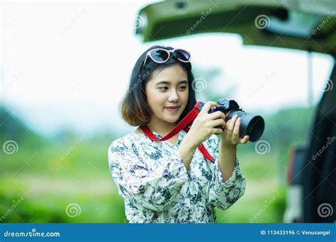 Asian Girl Holding A Camera And Checking Photo Stock Photo Image Of