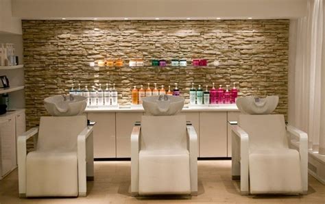 Peach Chairs With Decorative Stone Wall For Small Hair Salon Interior