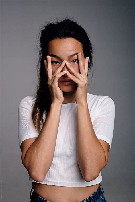 Asian Girl With Hands On Face By Stocksy Contributor Danil Nevsky Stocksy
