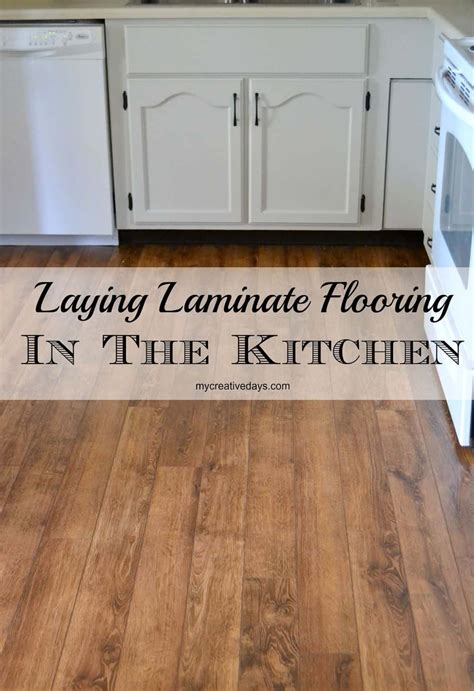 Yes, you can lay a wood floor over tile if the existing floor is in good shape and without cracks. Kitchen Makeover : Laminate Flooring - My Creative Days