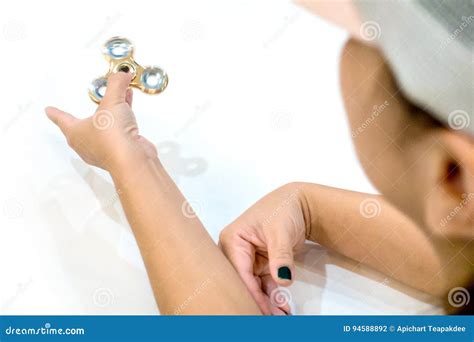 Woman Playing Gold Fidget Spinner Stock Photo Image Of Relaxation Energy