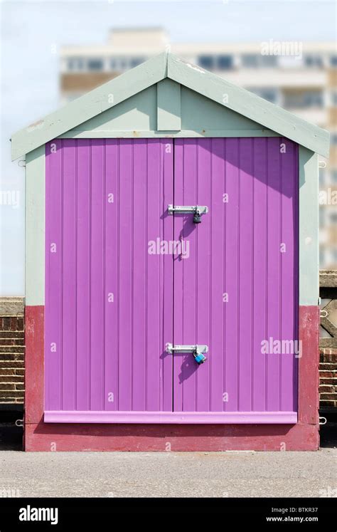 Beach Hut With Mauve Doors On Seafront Promenade At Hove Brighton