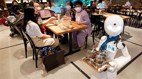 High Tech Café Opens With Robot Waiters That Can Be Controlled From