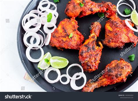 Serve with long grain basmati rice, cucumber salad, grilled veggies, roasted corn on the cob and finish off the meal with kulfi. Indian Style Roasted Tandoori Chicken with Lemon, Onion ...
