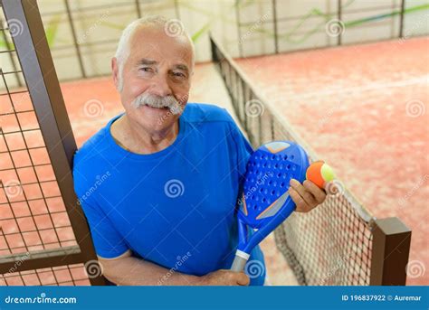 Happy Senior Male Tennis Player Indoors Stock Photo Image Of Platform