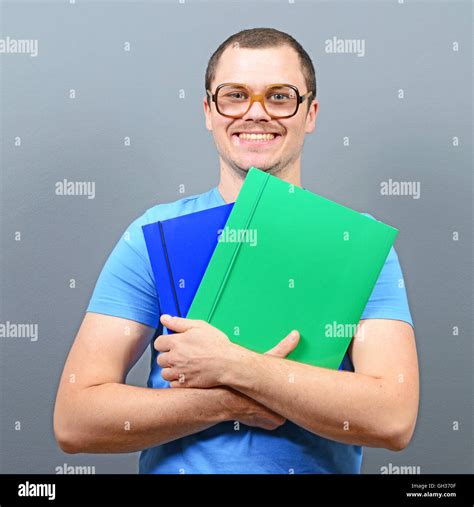 Portrait Of A Nerd Holding Books With Retro Glasses Stock Photo Alamy