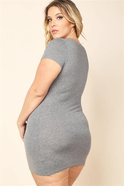 a plus size mini bodycon dress with a crew neckline and short sleeves tight stretch fit solid