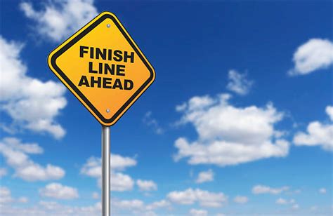 Finish Line Ahead On Yellow Road Sign Pictures Images And Stock Photos