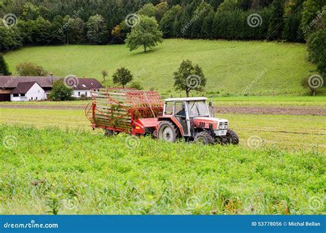 Red Tractor In The Field Near House Stock Photo Image Of Ecology