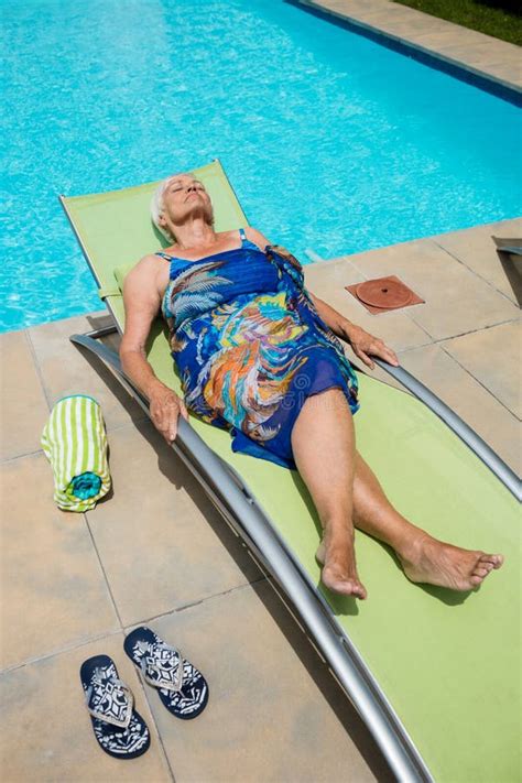 Senior Woman Sleeping On Lounge Chair Stock Photo Image Of Life Barefoot