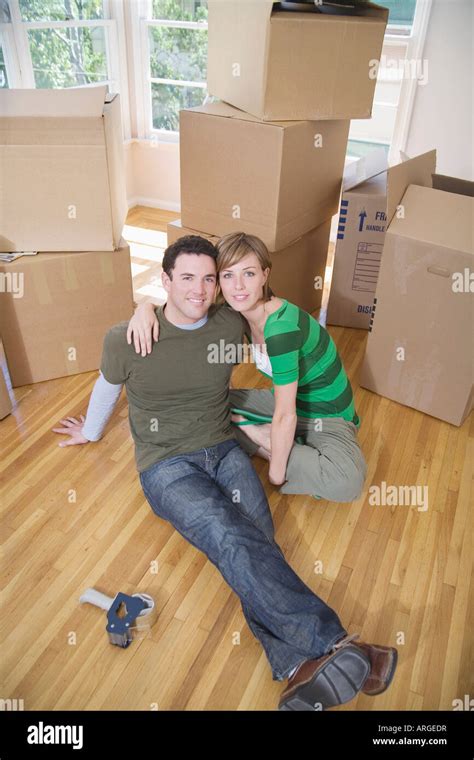 Couple Moving Into New Home Stock Photo Alamy