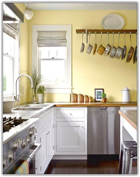 Michie schmitz, ckd and renee jordan, ckd are the owners and designers. Yellow Kitchens White Cabinets | Yellow kitchen walls ...