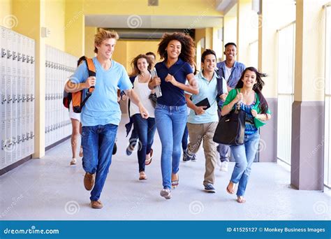Group Of High School Students Running In Corridor Stock Image Image
