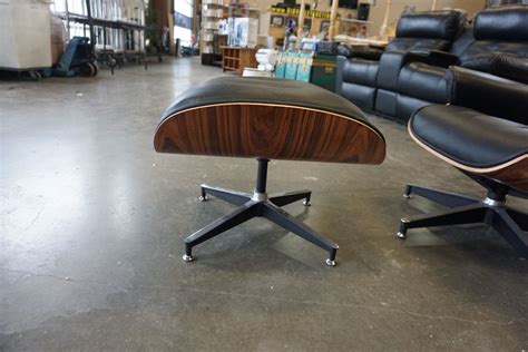 The cushions and ottoman are upholstered in 100% full grain aniline leather. AS NEW EAMES STYLE BLACK LEATHER AND TEAK FINISH SWIVEL ...