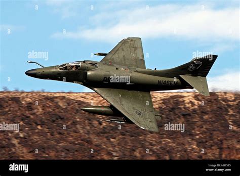 A Draken Operated Douglas A 4k Skyhawk Flies Low Level Through The