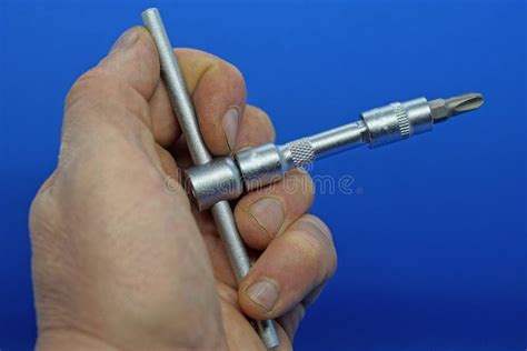 Hand Holds A Gray Iron Screwdriver Stock Photo Image Of Blue Holds