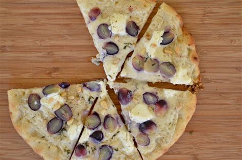 When the omelette is almost cooked, sprinkle the cheese over it. Grape and Ricotta Pizza with Fresh Thyme and Pine Nuts