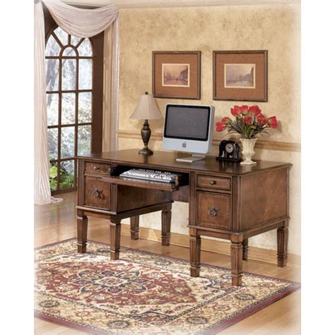 H527 26 Ashley Furniture Hamlyn Medium Brown Storage Leg Desk