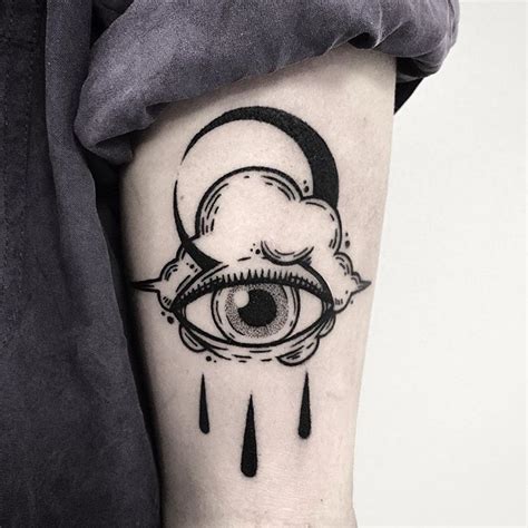 Crying Eye Cloud And Crescent Moon Tattoo Inked On The Left Upper Arm