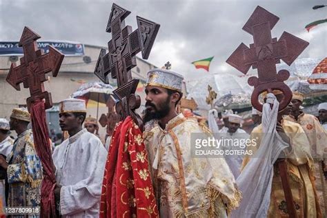 Ethiopian Orthodox Deacons Hold Crosses As They Parade During The