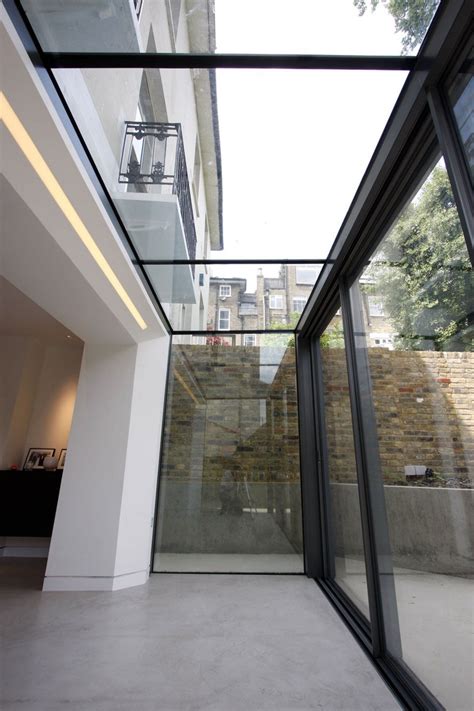 The Versatile Glass Extension On This Traditional Home Uses A Glass