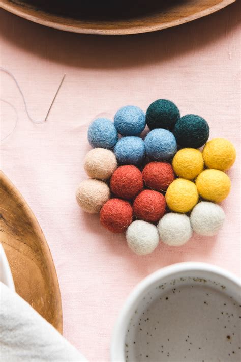 These diy felt coaster are available in many different materials to protect tables. DIY Felt Ball Coasters - The House That Lars Built