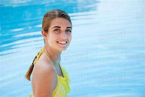 Babe Woman In Yellow Bikini By Swimming Pool Portrait Stock Photo Dissolve