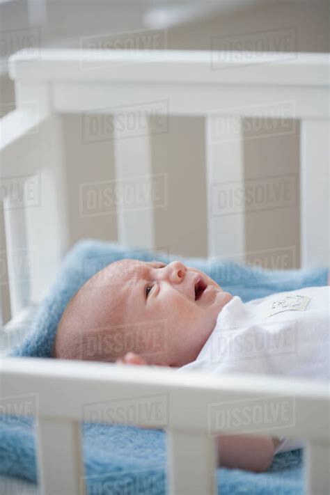 Baby Crying In Crib Stock Photo Dissolve