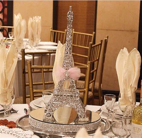 You can even evoke the city of lights in your table décor with the eiffel tower centerpiece. Paris Themed Centerpieces - DIY Cuteness