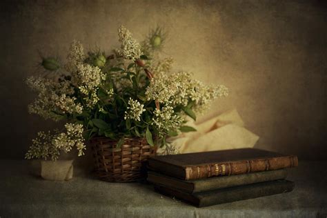 Still Life With Old Books And White Flowers In The Basket Photograph By