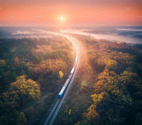 Train In Colorful Forest In Fog Aerial View Landscape Photos Aerial