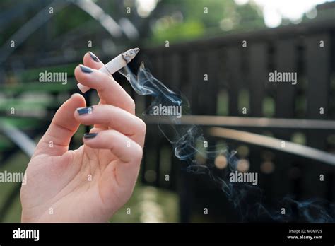 Female Hand Holding Cigarette Hi Res Stock Photography And Images Alamy
