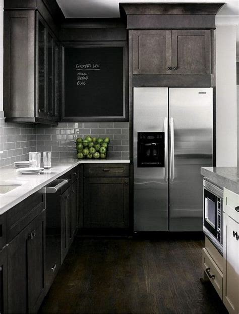 Just inside these sleek grey kitchen cabinets are solid. I LOVE!!! dark black brown cabinets & stainless steel ...