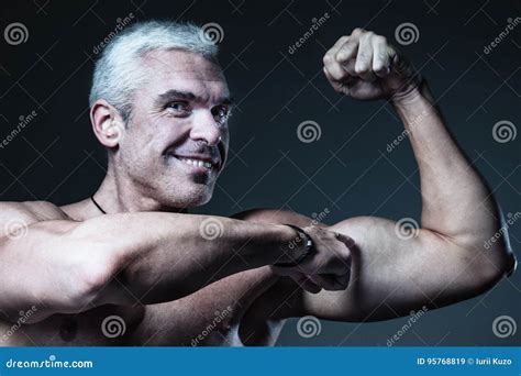 Strong Man Fitness Model Showing Flexing Bicep Muscle Healthy L Stock