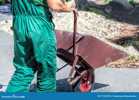 Worker With A Wheelbarrow Stock Photo Image Of Filled 31726796