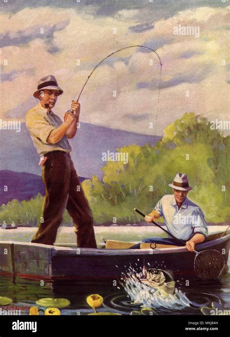 Two Men Fishing In Boat Stock Photo Alamy
